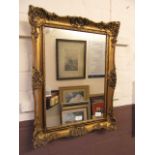 An ornate gilt framed mirror