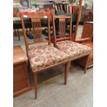 A pair of Edwardian box wood strung and inlaid side chairs having upholstered seats