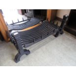 A modern cast iron black painted fire grate CONDITION REPORT: Width: 91cm Depth: