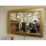 A modern gilt framed mirror