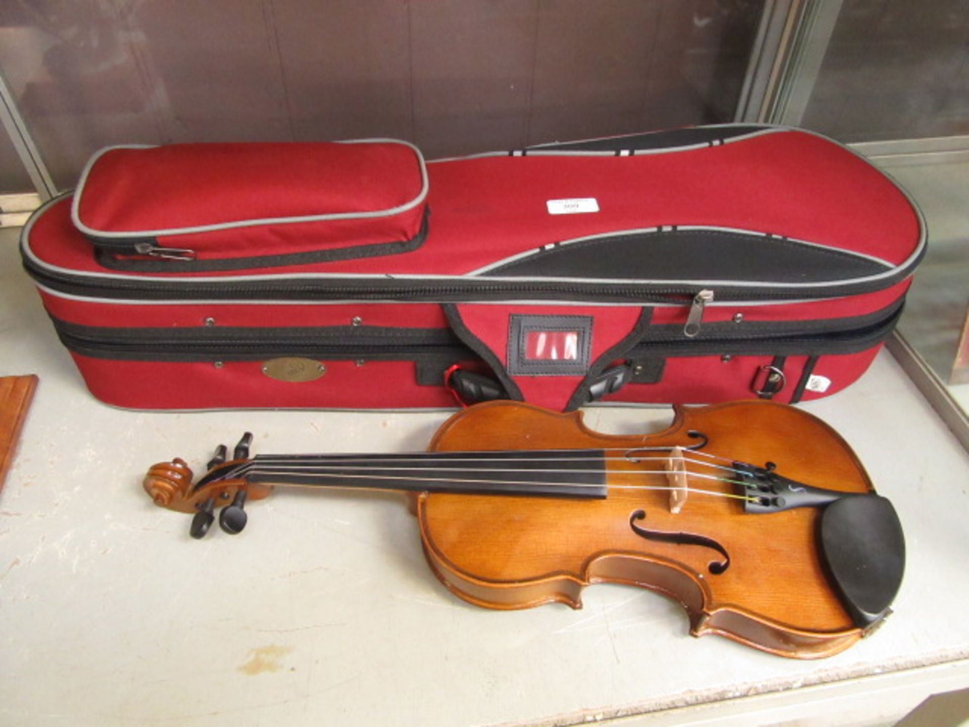 A Senator Student II violin in case CONDITION REPORT: Violin is 1/4 size (50cm
