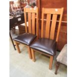 Two modern oak dining chairs