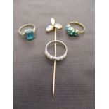 Two yellow metal rings together with a 9ct gold ring and a yellow metal and moonstone stick pin,