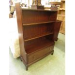 A stag style mahogany bookcase with drawer to base