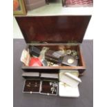 A box of assorted costume jewellery and coinage