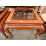 A Chinese glass topped part oak coffee table