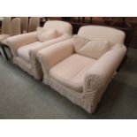 A pair of cream fabric upholstered lounge chairs