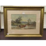 A framed and glazed watercolour of cattle in river signed W.