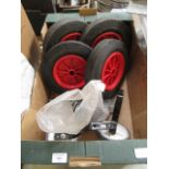 A tray containing a set of four wheels, stabilizers etc.