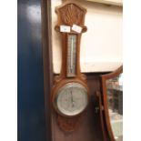 An early 20th century carved oak banjo barometer