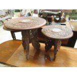 Two eastern carved wood collapsible occasional tables