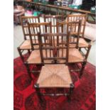 A set of six reproduction beech framed dining chairs with sea grass seat