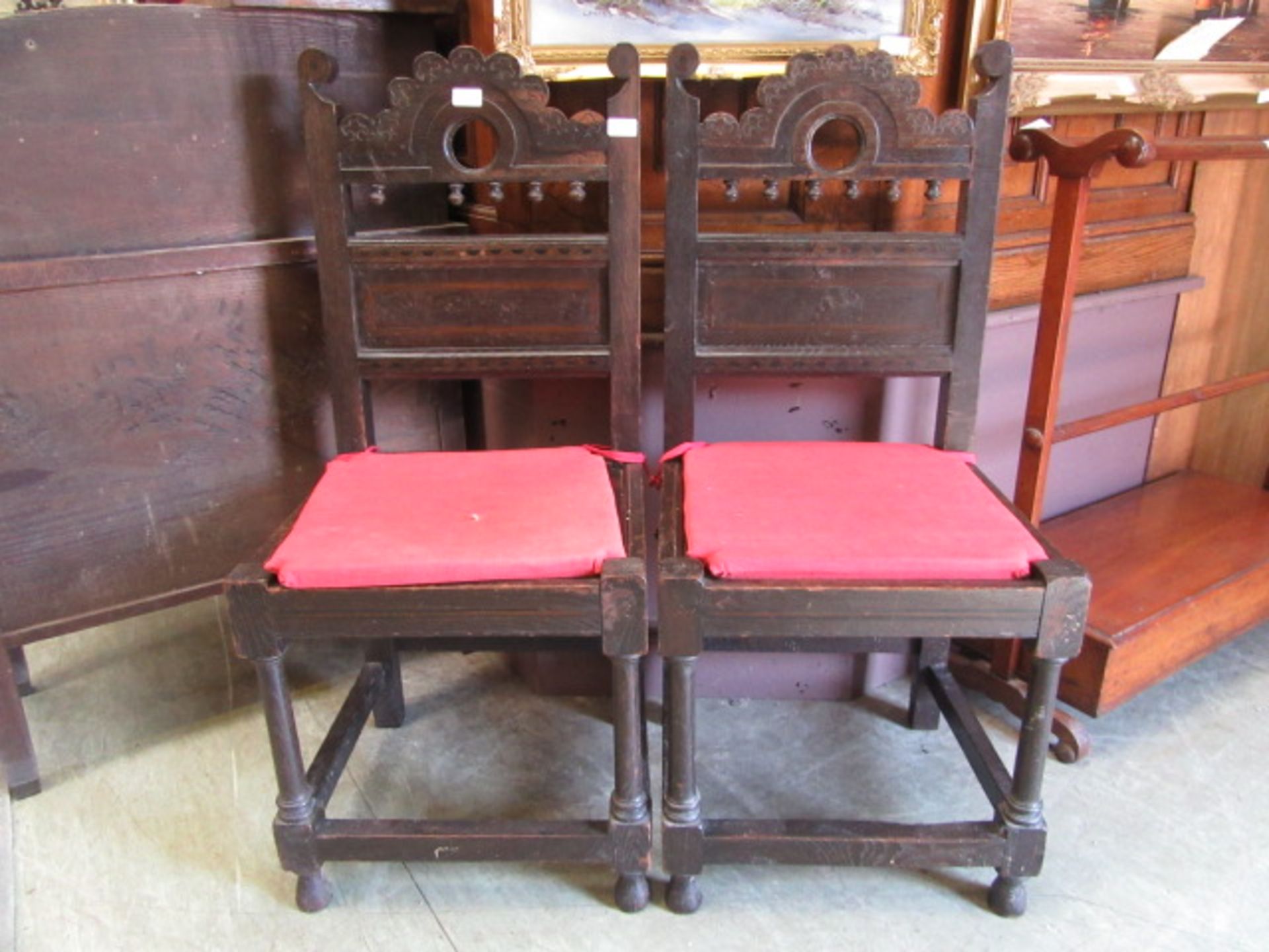 A pair of late 17th century style oak and inlaid back stools