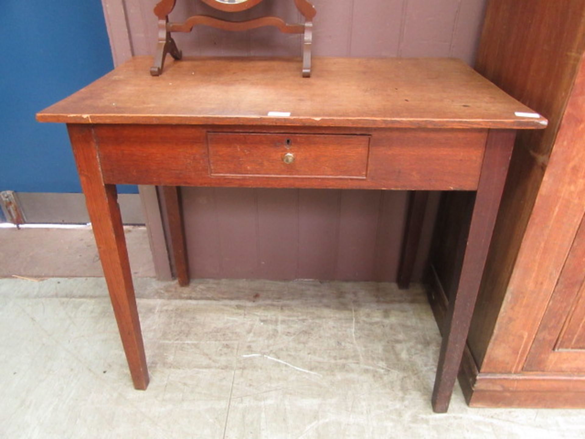 An 18th century oak single drawer side table