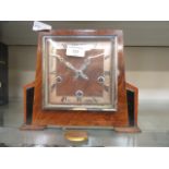 An early 20th century walnut cased mantle clock