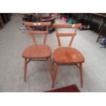 A pair of ercol chairs CONDITION REPORT: No apparent damage or repairs,