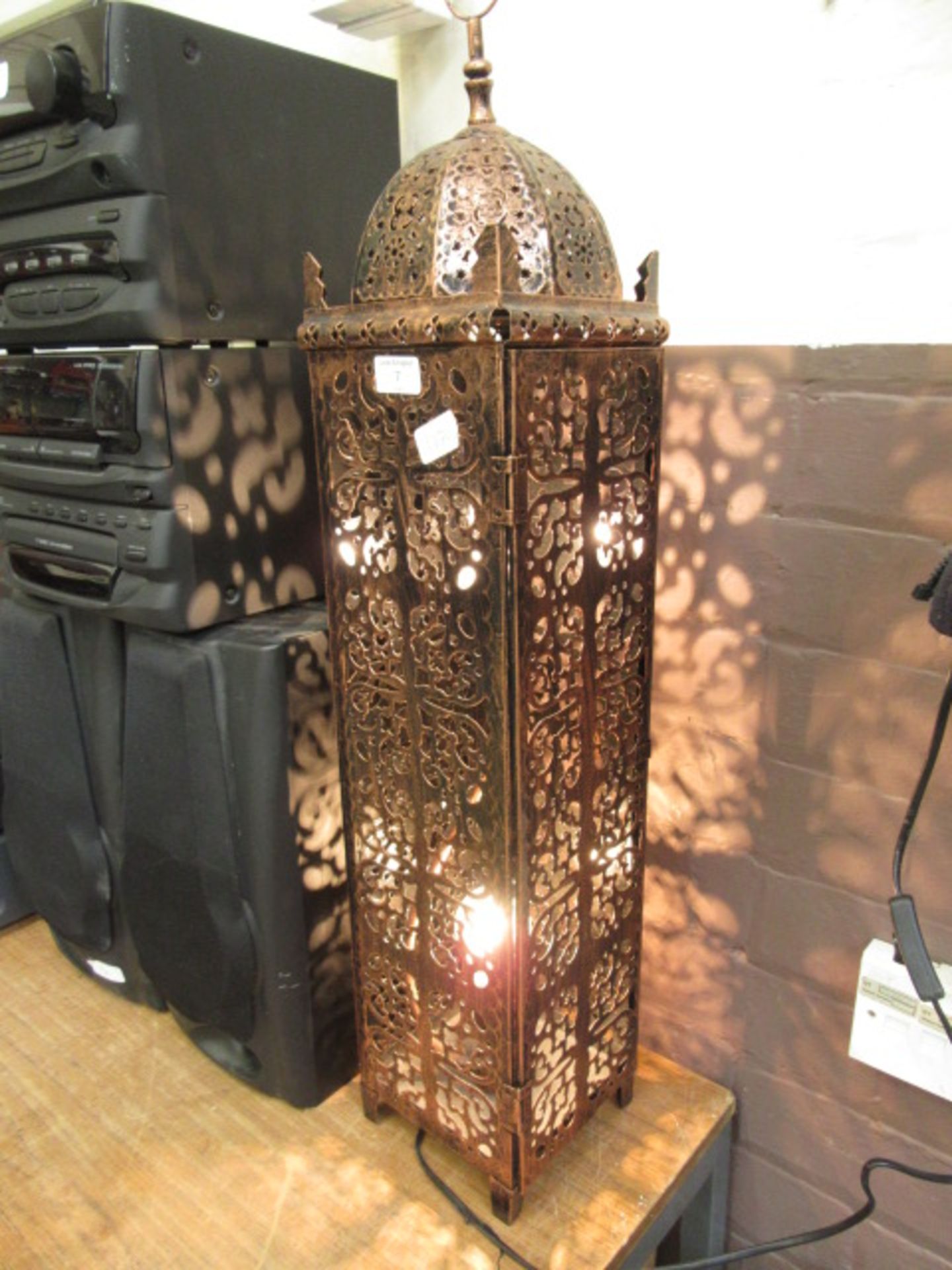 An eastern style pierced metal lamp