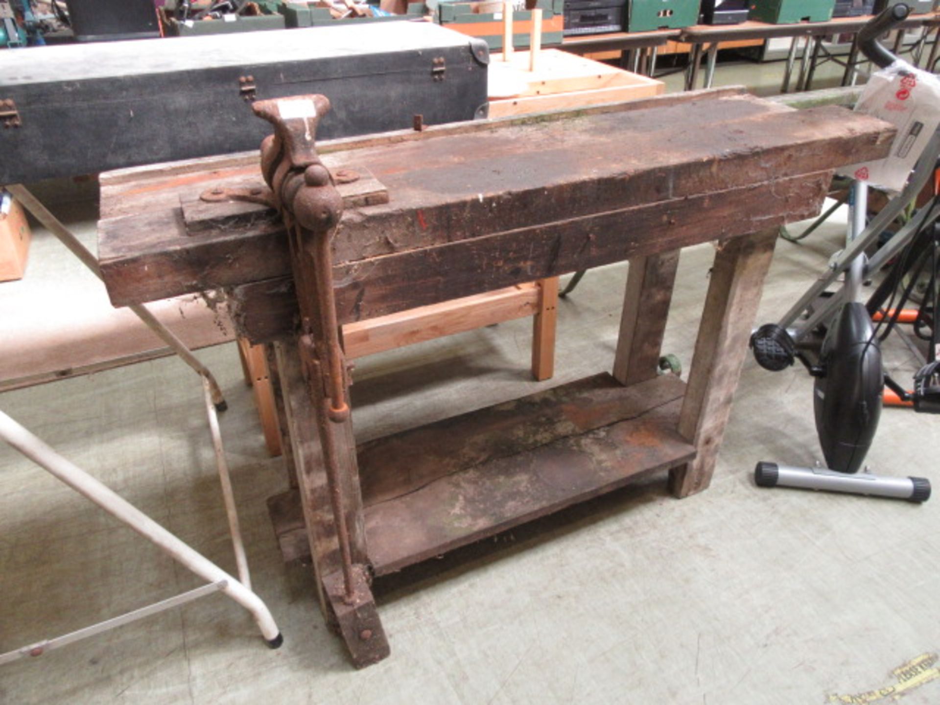 A wooden work bench with vice