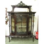 An early 20th century walnut display cabinet,