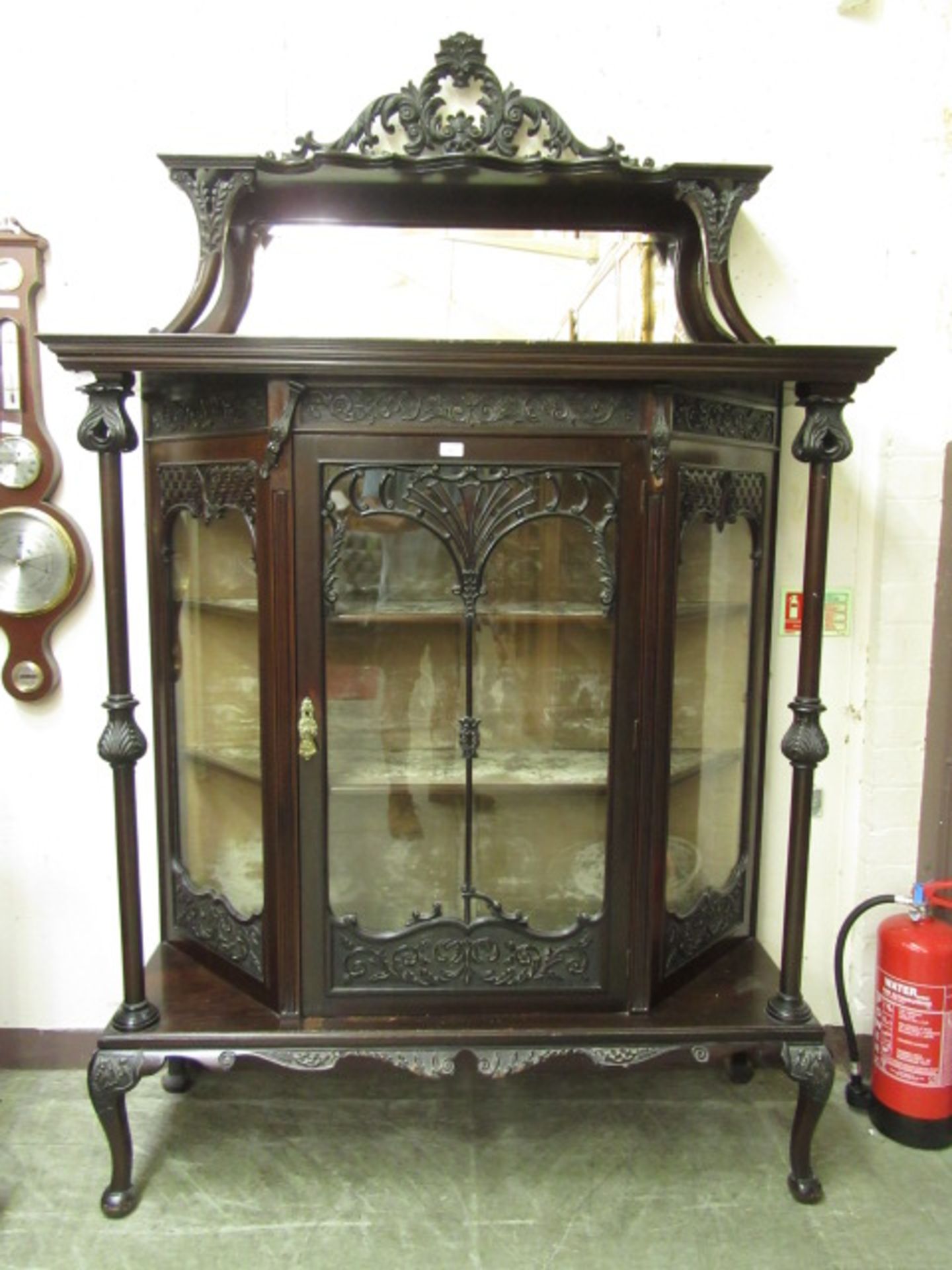 An early 20th century walnut display cabinet,
