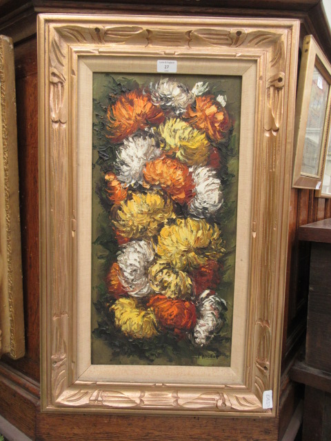 A framed oil on canvas of chrysanthemums signed bottom right