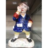 An 18th century style figure of a gentleman with thumb up nose (A/F)