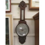 An early 20th century oak banjo barometer