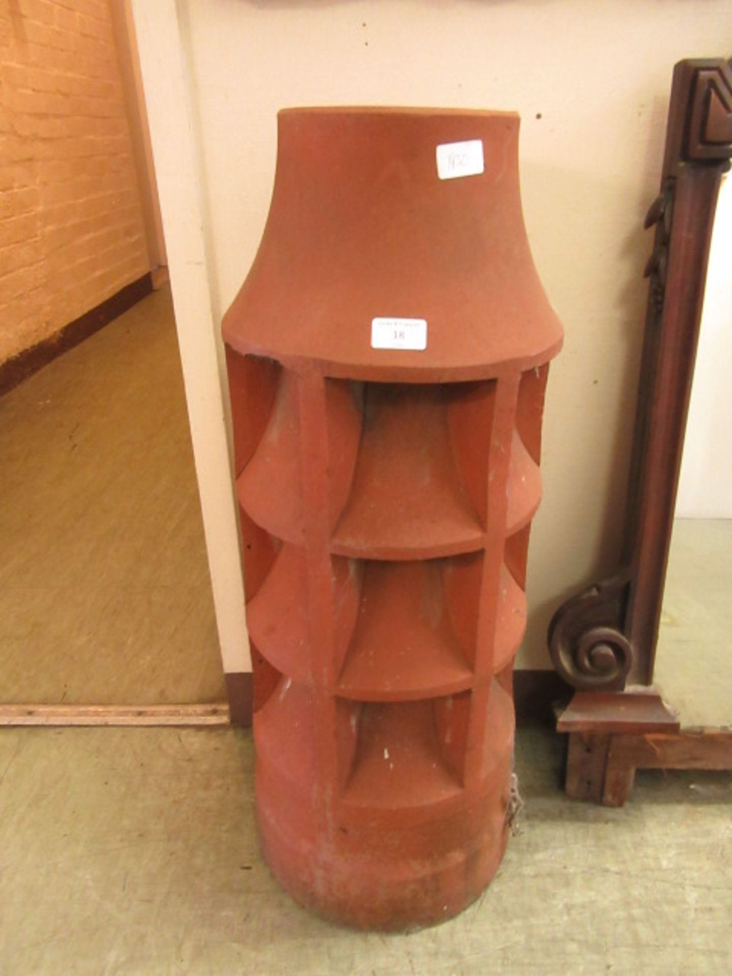 A terracotta chimney pot