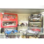 A selection of boxed and unboxed cars by Burago and Tonka