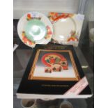 A Crocus design Clarice Cliff plate together with one othe square Clarice Cliff plate and two