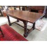 A modern 18th century style oak dining table,