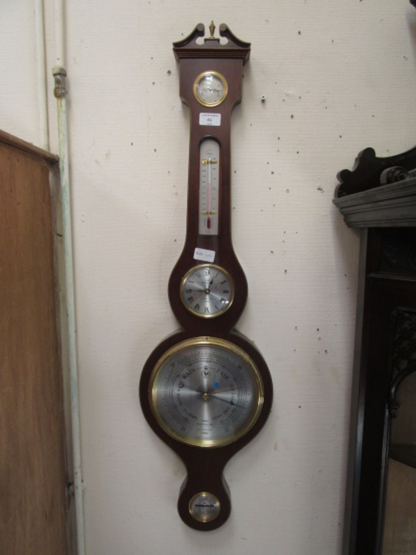 A reproduction mahogany banjo barometer by Sewills of Liverpool