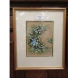 A framed and glazed watercolour of ivy and flowers signed H.E.