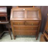 An early 20th century oak bureau,