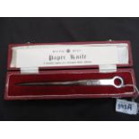 A cased reproduction paper knife,