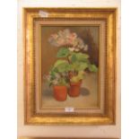 A framed oil on canvas of still life signed Aziza