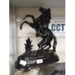 A black painted molded model of rearing horse