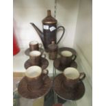 A part mid-20th century stoneware coffee set by Presto Potteries comprising of five cups and six