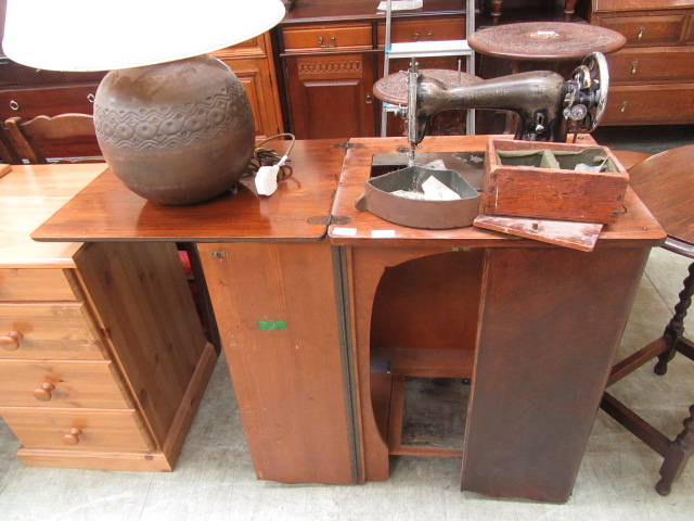 An early 20th century treadle sewing machine