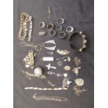 A bag containing an assortment of silver and white metal bangles, rings etc. approx.
