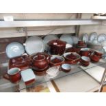 A large quantity of Denby tableware comprising of tureens, cups, saucers, tea pot, bowls,