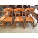 A set of three spindle back dining chairs