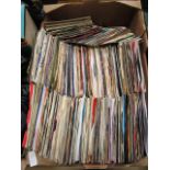 A tray containing a quantity of 45 rpm records by various artists