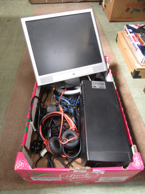 A box containing computer wires, screen etc.