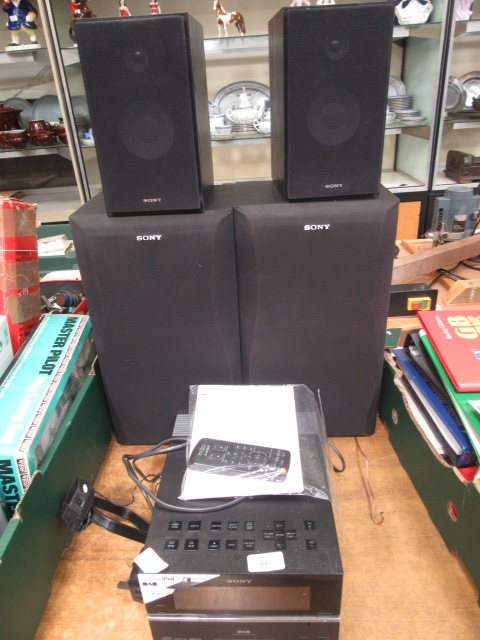 A Sony mico hi-fi system with two pairs of Sony speakers and remote