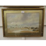 A framed and glazed beach scene with sailing vessels in background signed W.S.