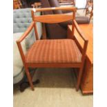 A mid 20th century teak open arm chair