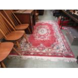 A Chinese pink ground rug