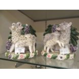 A pair of 19th century style Staffordshire flat back bud vases in the form of sheep