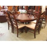 A modern oval dining table with a set of six matching chairs